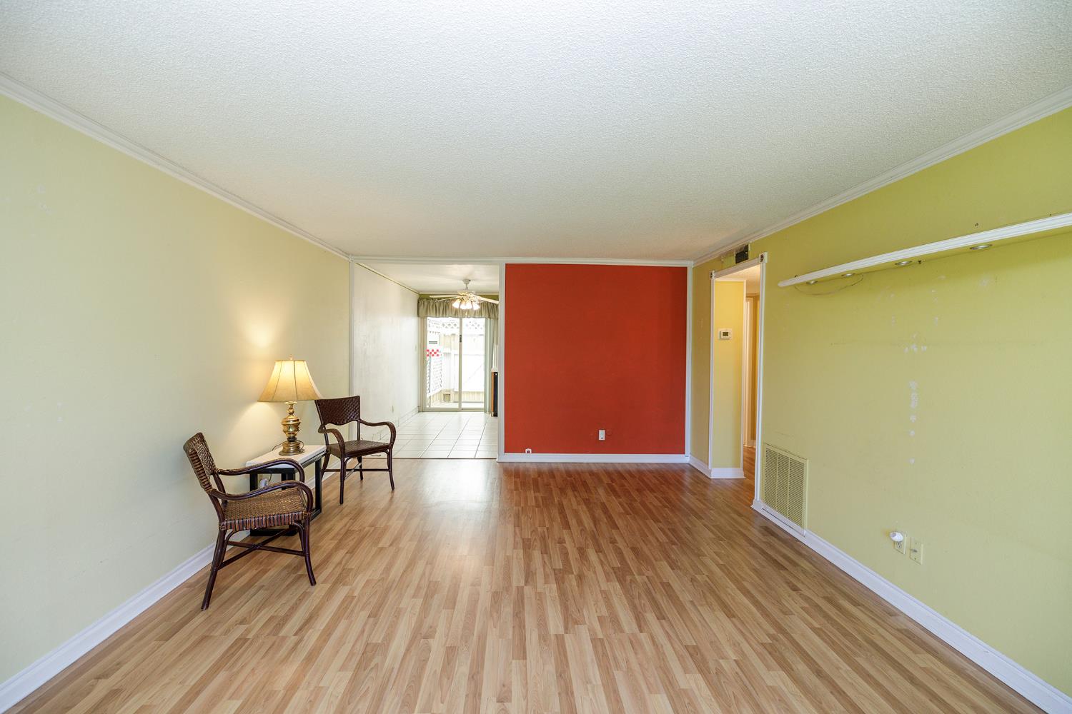 617 West Granger Avenue, Unit 48 Modesto, CA 95350 - Photo 6 of 27 a furnished livingroom with a window and chairs in a room