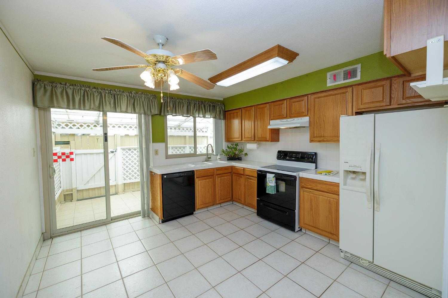 617 West Granger Avenue, Unit 48 Modesto, CA 95350 - Photo 10 of 27 a kitchen with stainless steel appliances granite countertop a stove a sink and a refrigerator