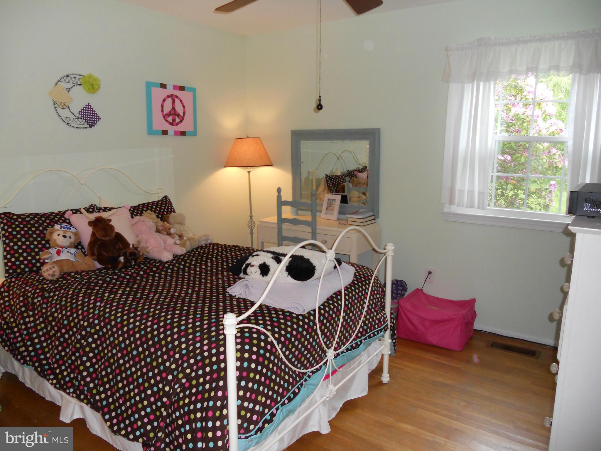 19129 Willow Grove Road Olney, MD 20832 - Photo 12 of 18 a bedroom with furniture and a window