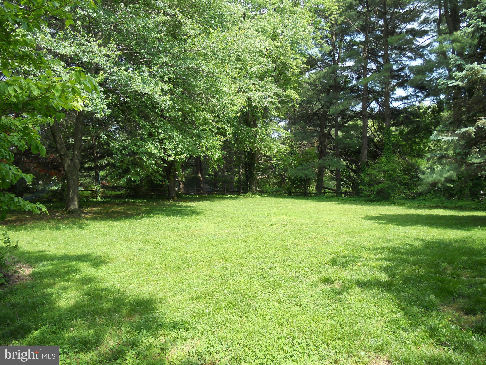 19129 Willow Grove Road Olney, MD 20832 - Photo 14 of 18 a view of outdoor space with deck and yard