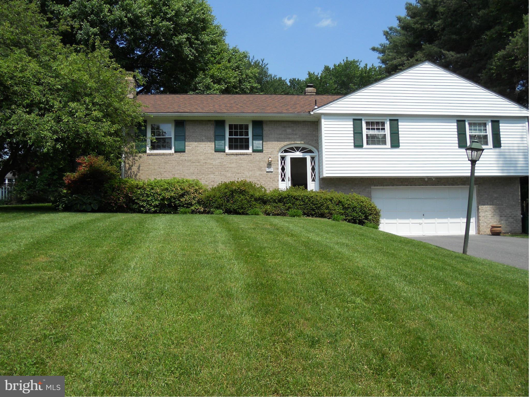 19129 Willow Grove Road Olney, MD 20832 - Photo 16 of 18 a front view of a house with a yard