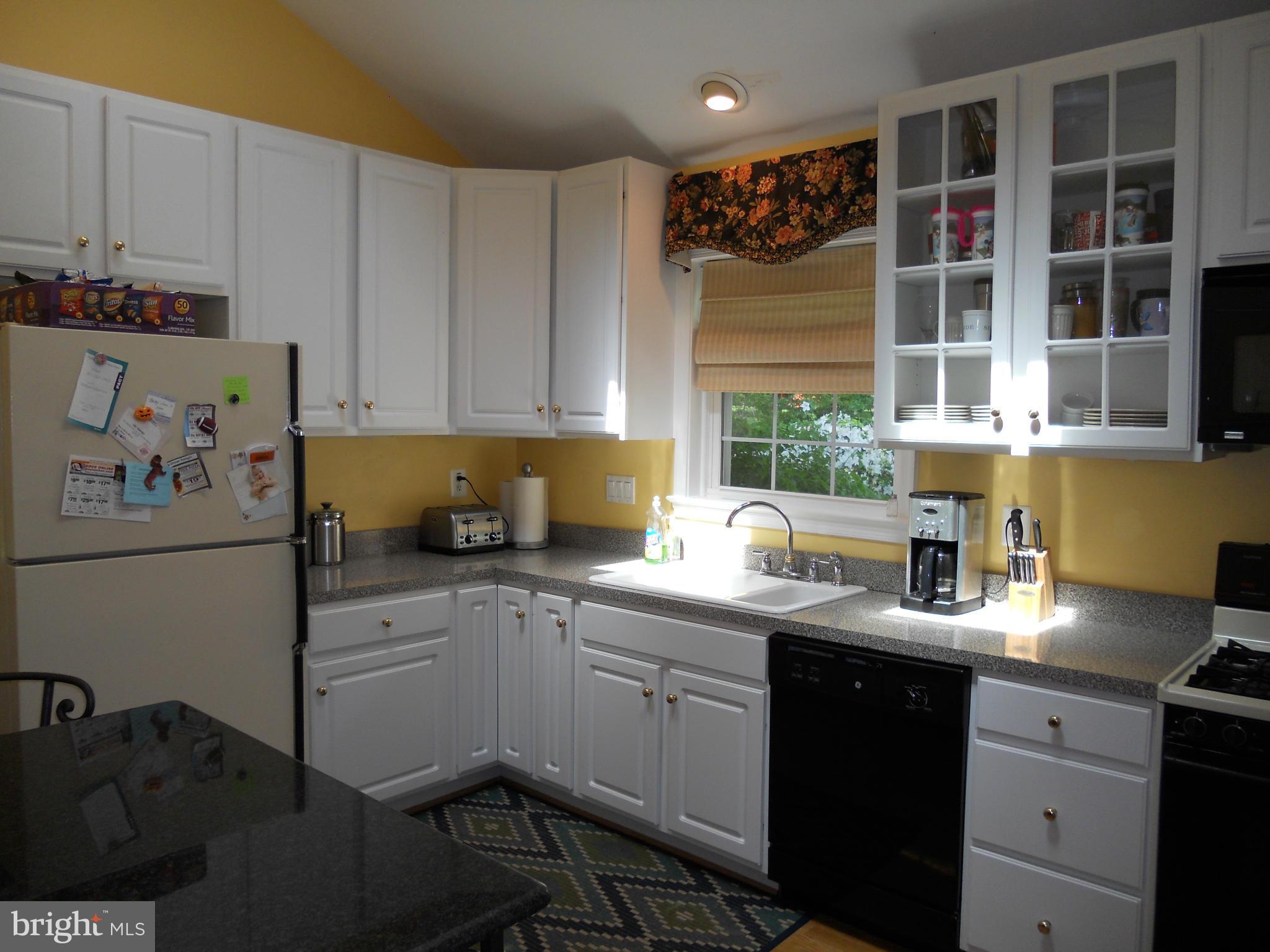 19129 Willow Grove Road Olney, MD 20832 - Photo 4 of 18 a kitchen with a sink and cabinets
