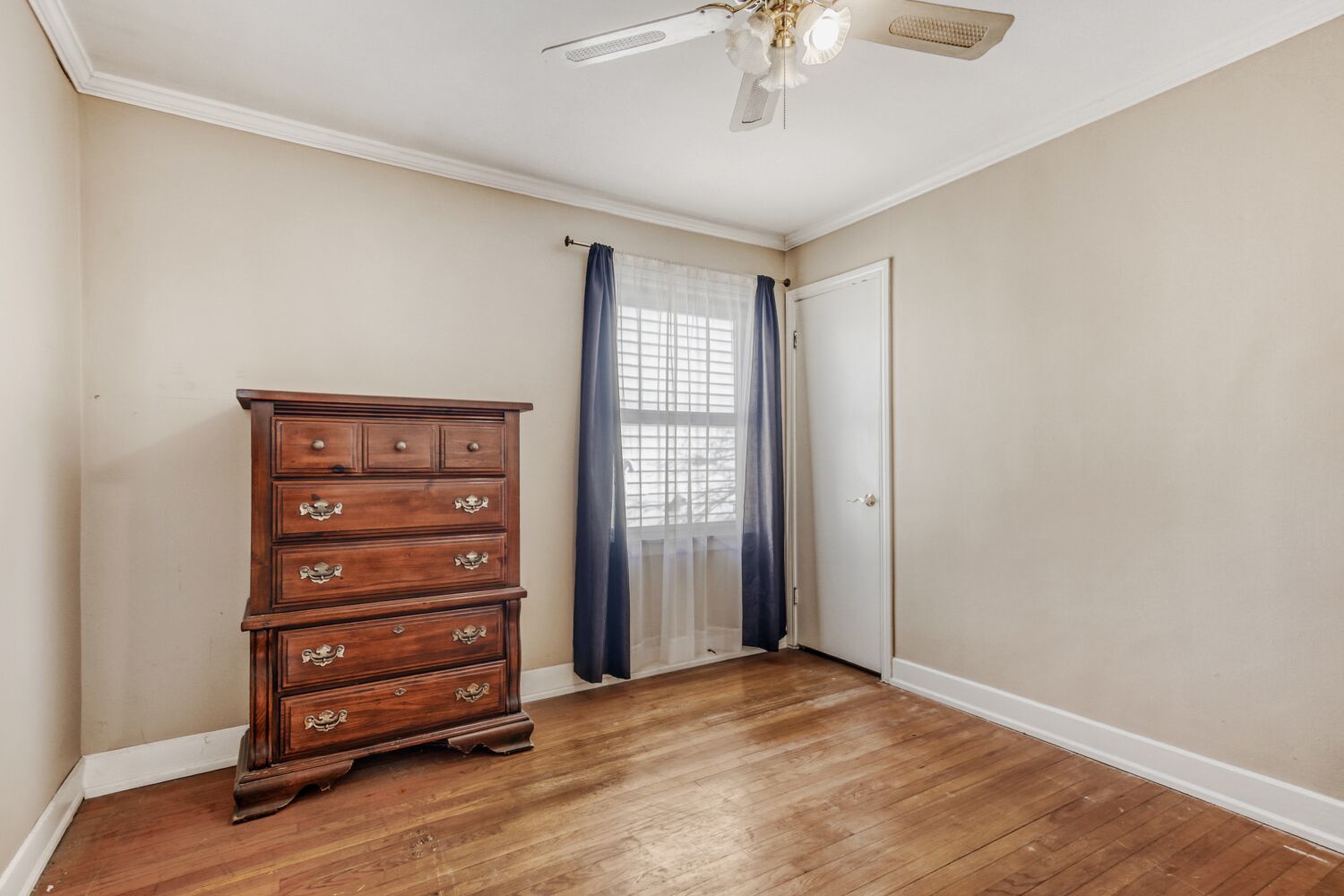3659 Madison Street Lansing, IL 60438 - Photo 12 of 28 a view of an empty room with a window and wooden floor