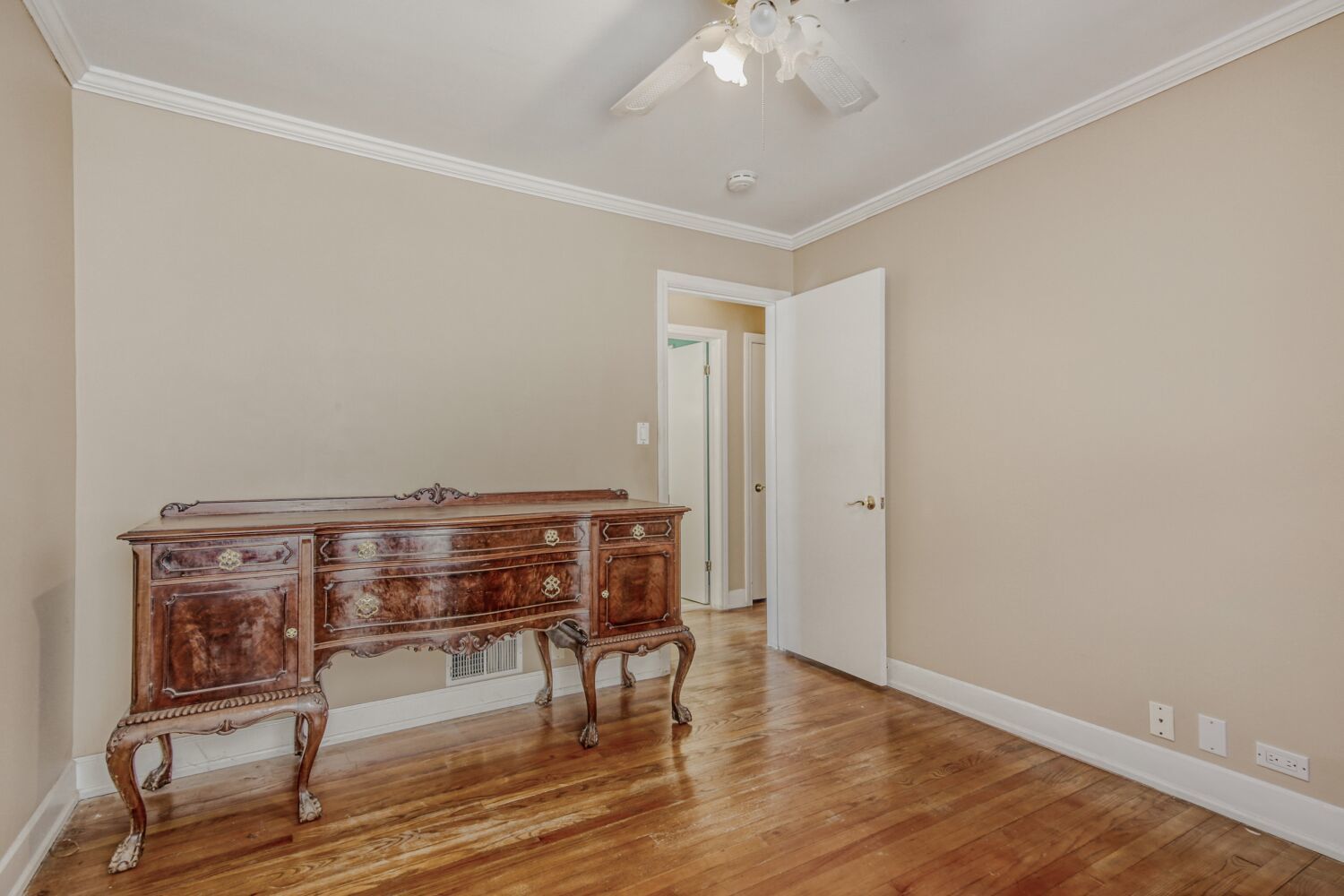 3659 Madison Street Lansing, IL 60438 - Photo 13 of 28 a view of room with wooden floor and fan