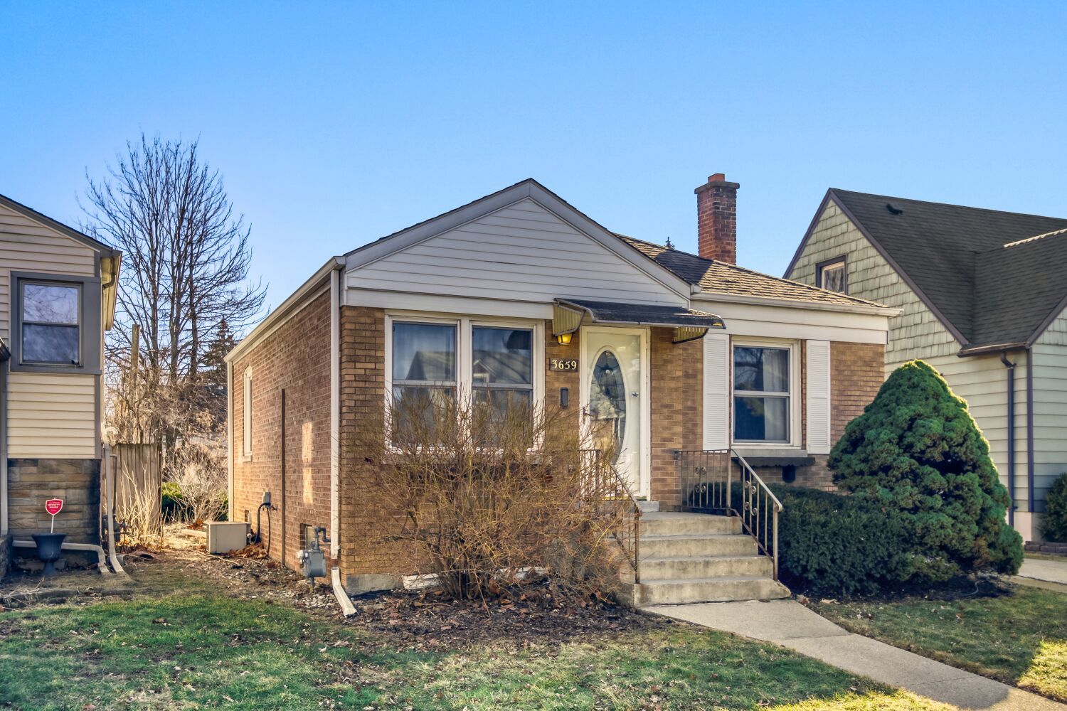 3659 Madison Street Lansing, IL 60438 - Photo 2 of 28 a front view of a house with garden