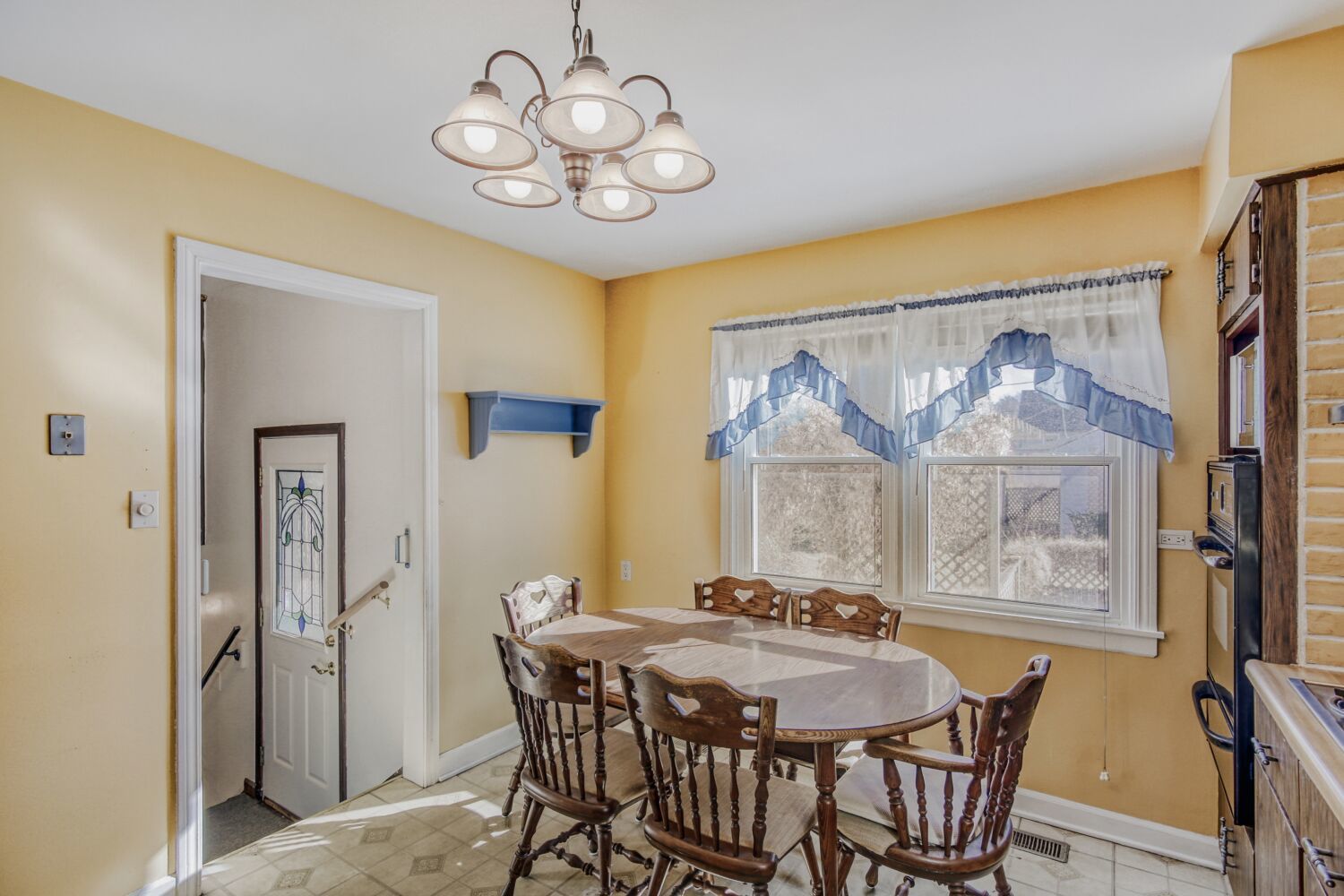 3659 Madison Street Lansing, IL 60438 - Photo 10 of 28 a view of a dining room with furniture and chandelier
