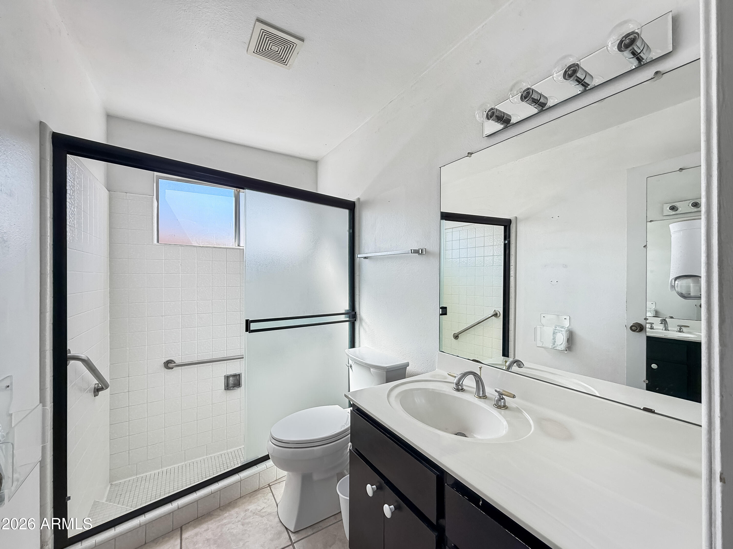 7848 North 5th Avenue Phoenix, AZ 85021 - Photo 17 of 28 a bathroom with a sink toilet and mirror
