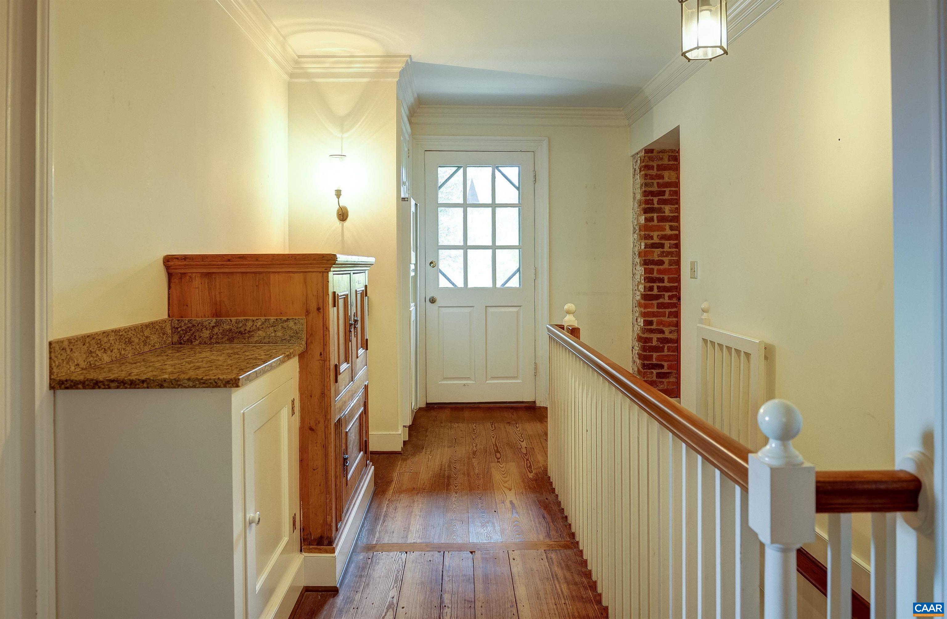 2051 Polo Grounds Road Charlottesville, VA 22911 - Photo 14 of 74 a view of a hallway with wooden floor and staircase