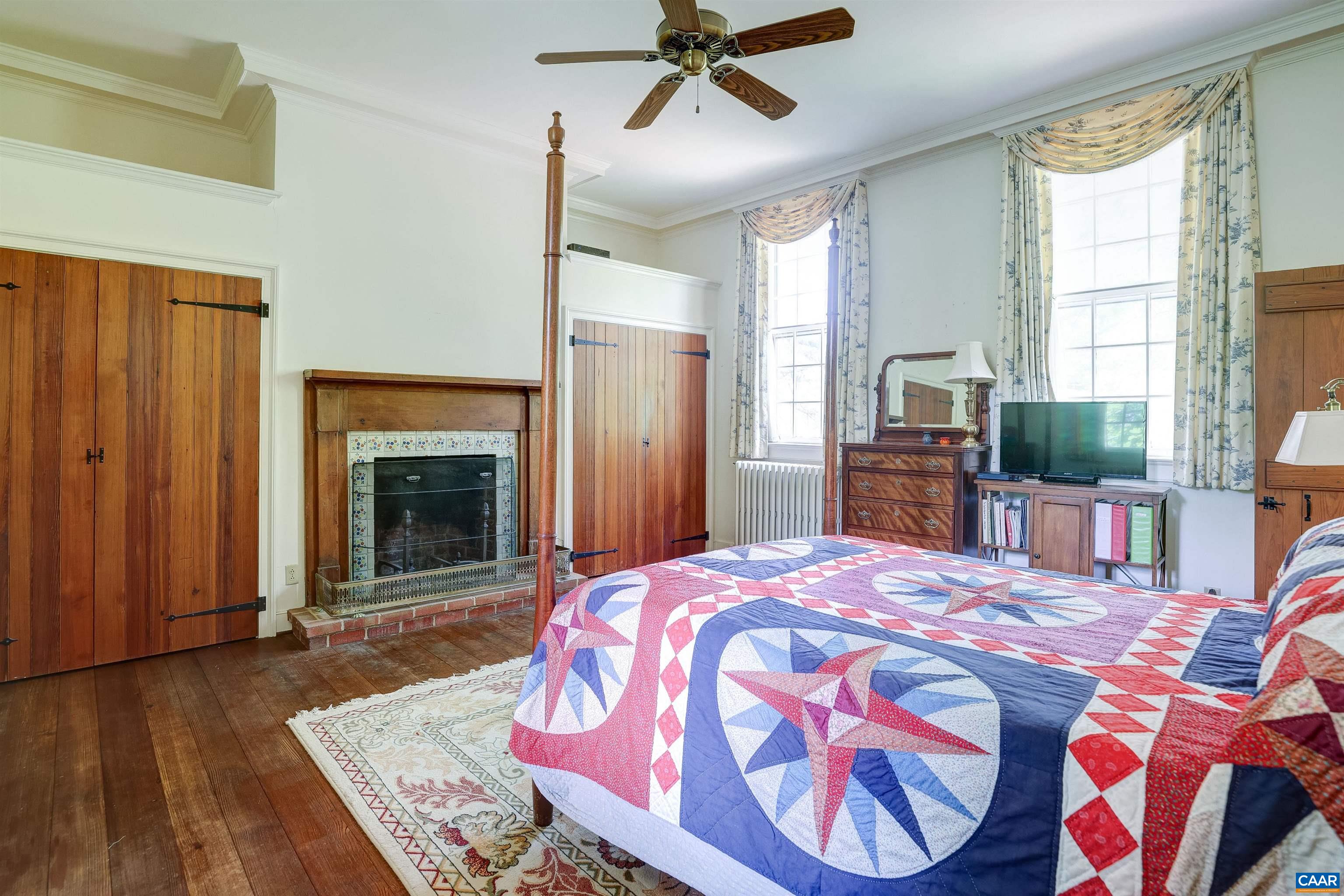 2051 Polo Grounds Road Charlottesville, VA 22911 - Photo 17 of 74 a bedroom with a bed and a fireplace