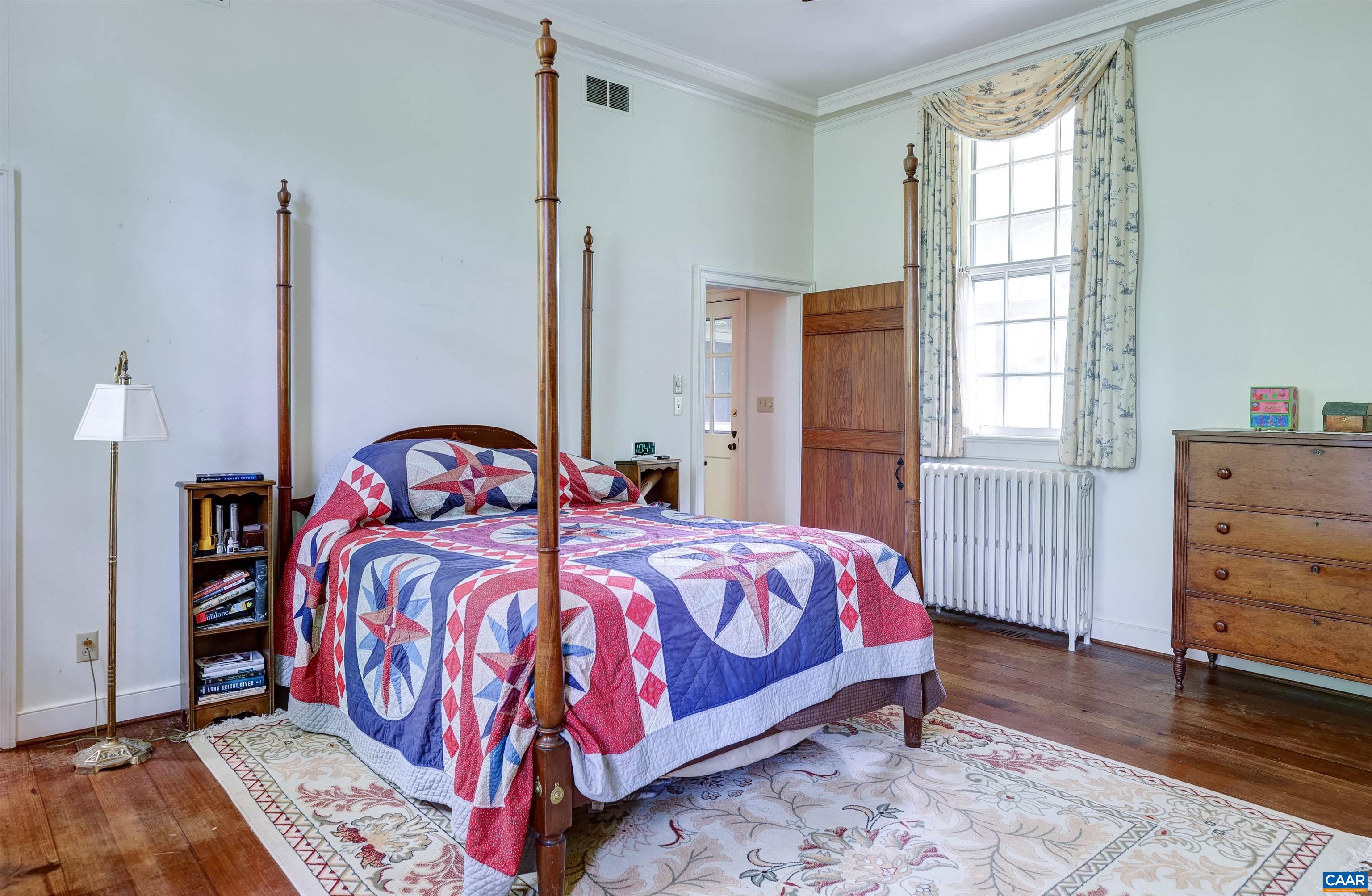 2051 Polo Grounds Road Charlottesville, VA 22911 - Photo 19 of 74 a bedroom with a bed and a dresser