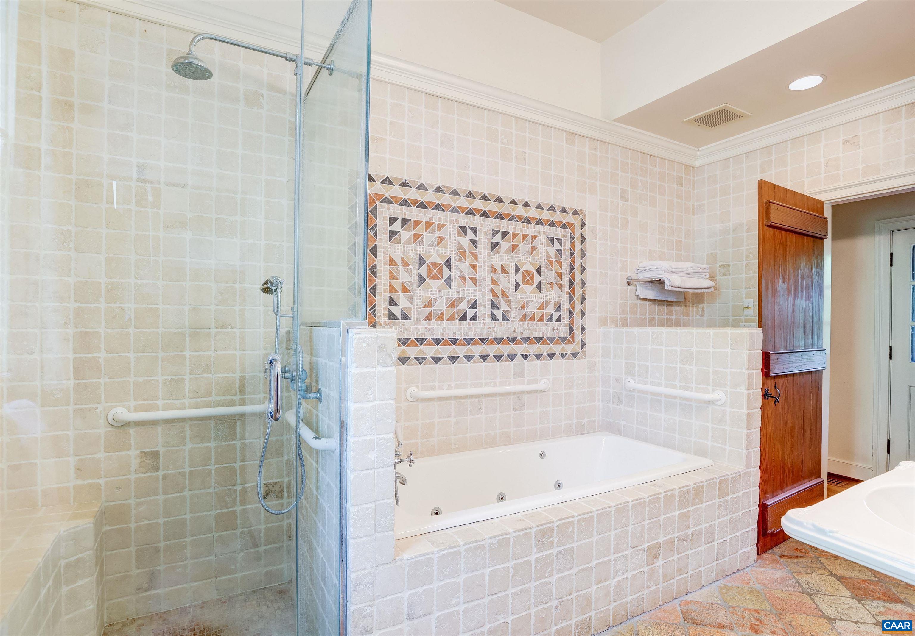 2051 Polo Grounds Road Charlottesville, VA 22911 - Photo 21 of 74 a bathroom with a bathtub and a shower