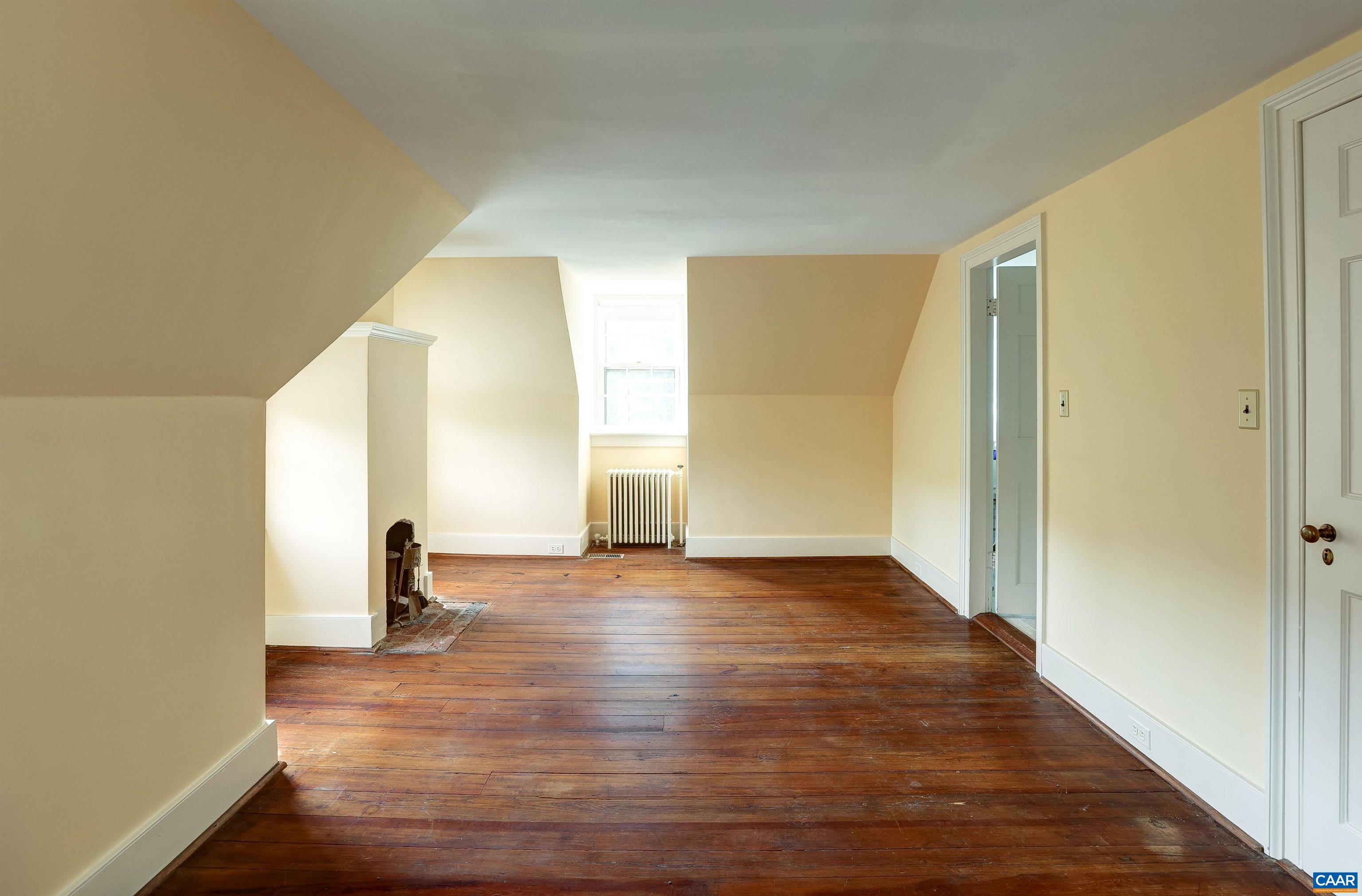 2051 Polo Grounds Road Charlottesville, VA 22911 - Photo 27 of 74 a view of empty room with wooden floor and fan