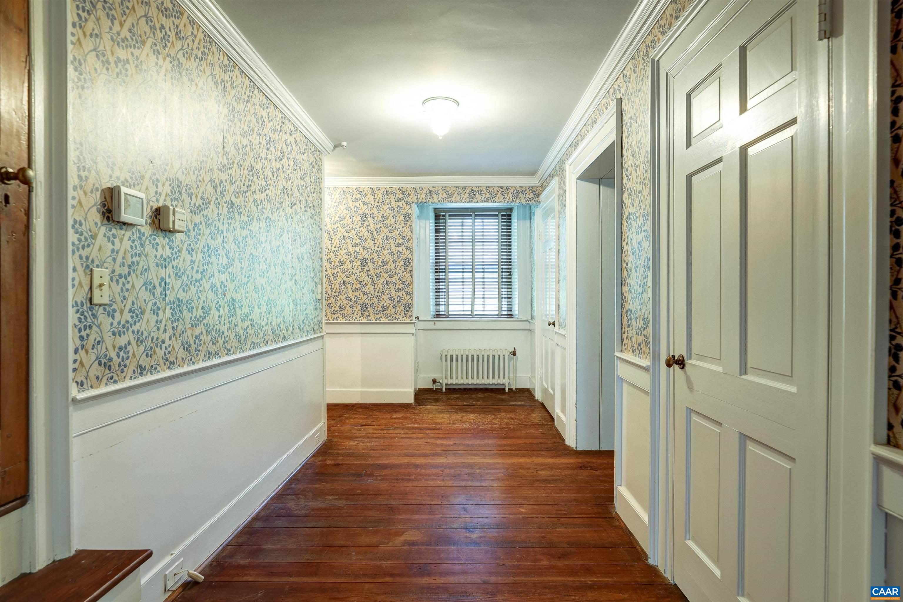 2051 Polo Grounds Road Charlottesville, VA 22911 - Photo 28 of 74 a view of a hallway with wooden floor and staircase