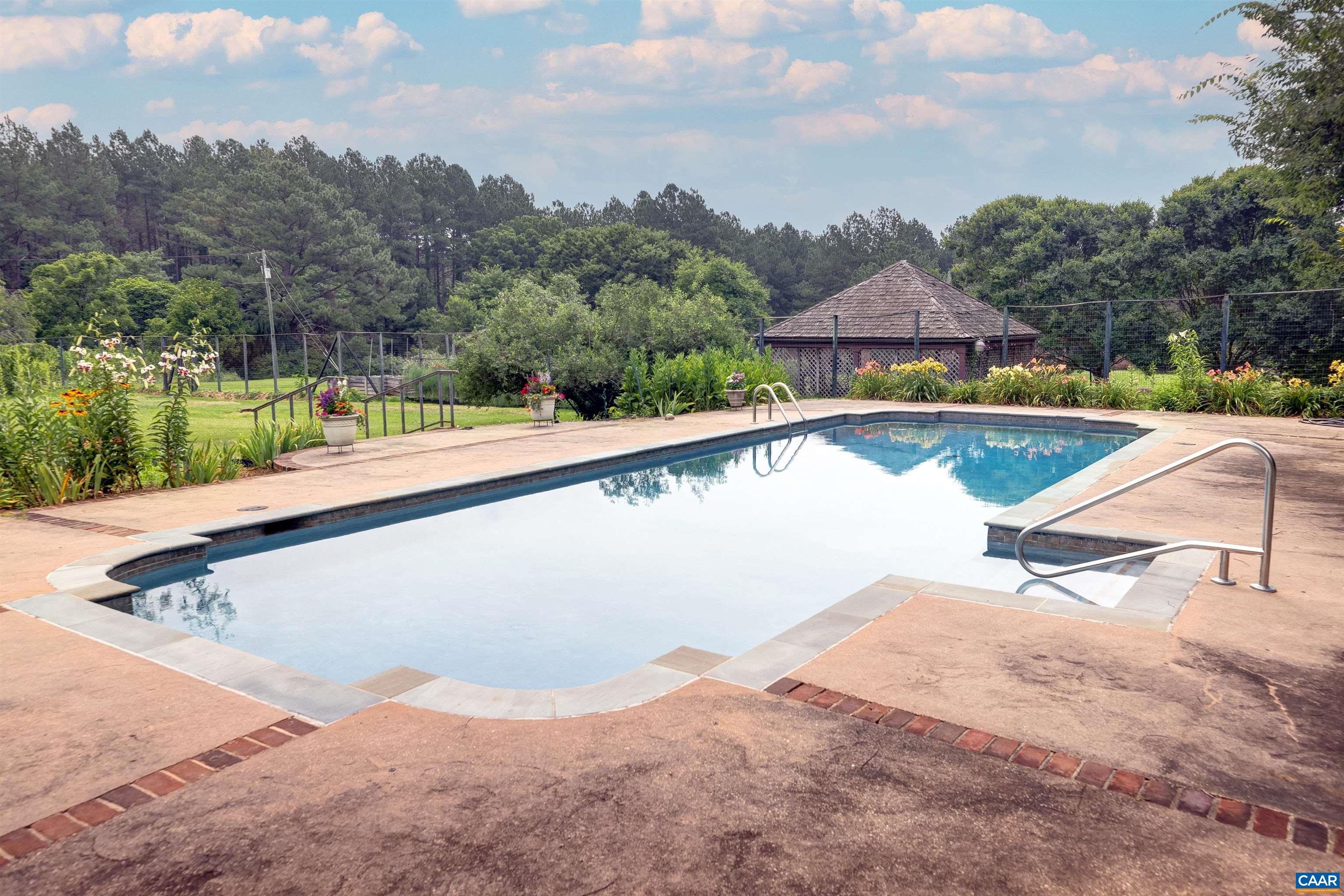 2051 Polo Grounds Road Charlottesville, VA 22911 - Photo 53 of 74 a view of swimming pool with a yard and large tree