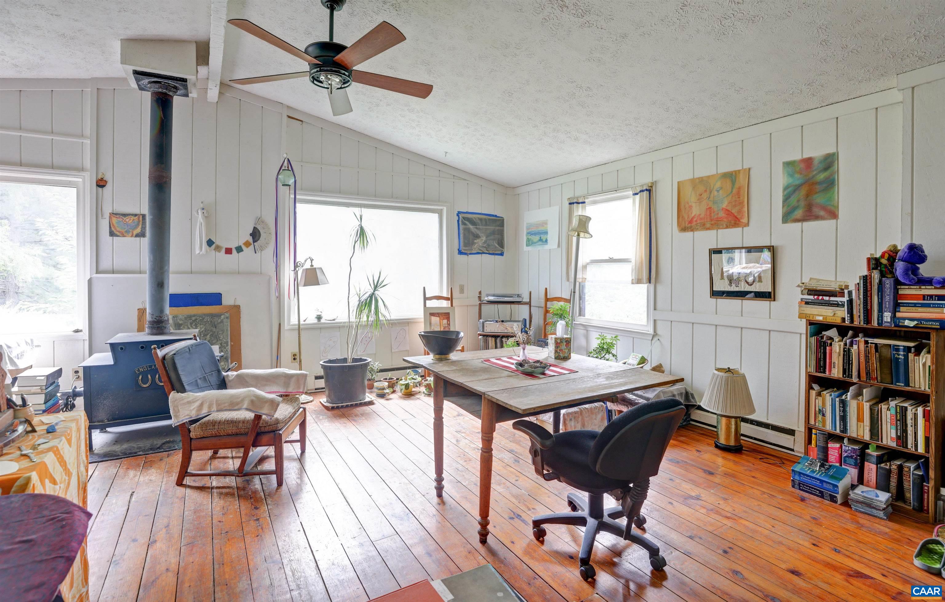 2051 Polo Grounds Road Charlottesville, VA 22911 - Photo 60 of 74 a view of a livingroom with furniture and a bookshelf