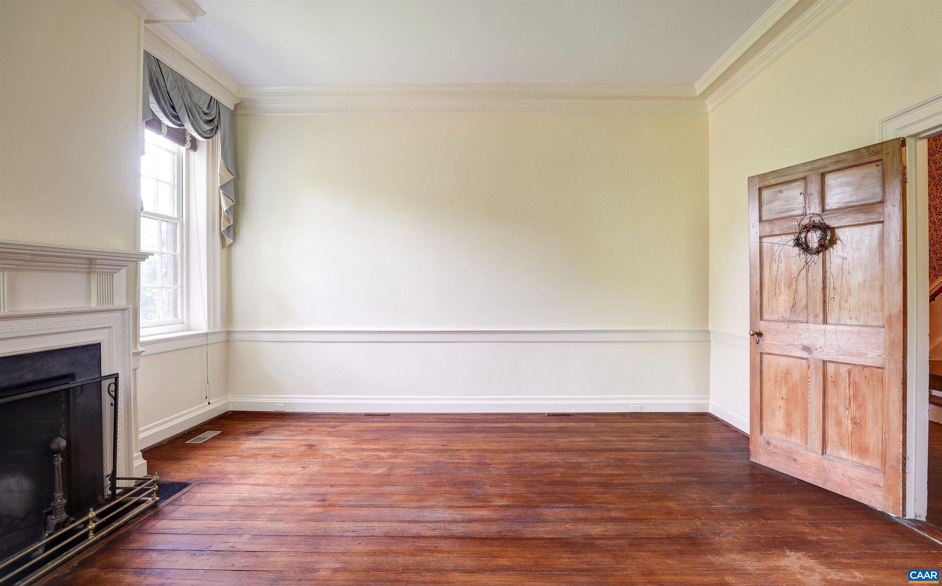 2051 Polo Grounds Road Charlottesville, VA 22911 - Photo 6 of 74 a view of an empty room with window and wooden floor