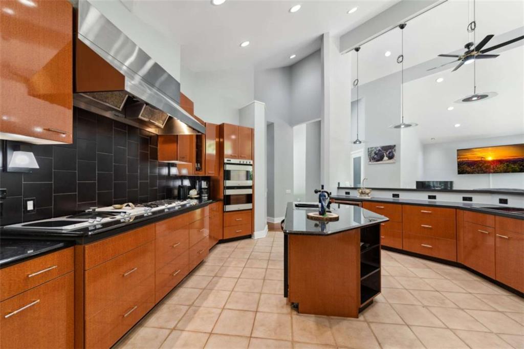 10323 Old CCC Camp Road Chatsworth, GA 30705 - Photo 49 of 97 a kitchen with stainless steel appliances granite countertop a sink and cabinets