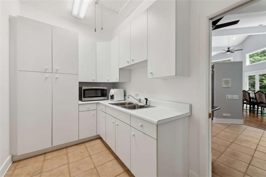 10323 Old CCC Camp Road Chatsworth, GA 30705 - Photo 54 of 97 a kitchen with a sink cabinets and stove