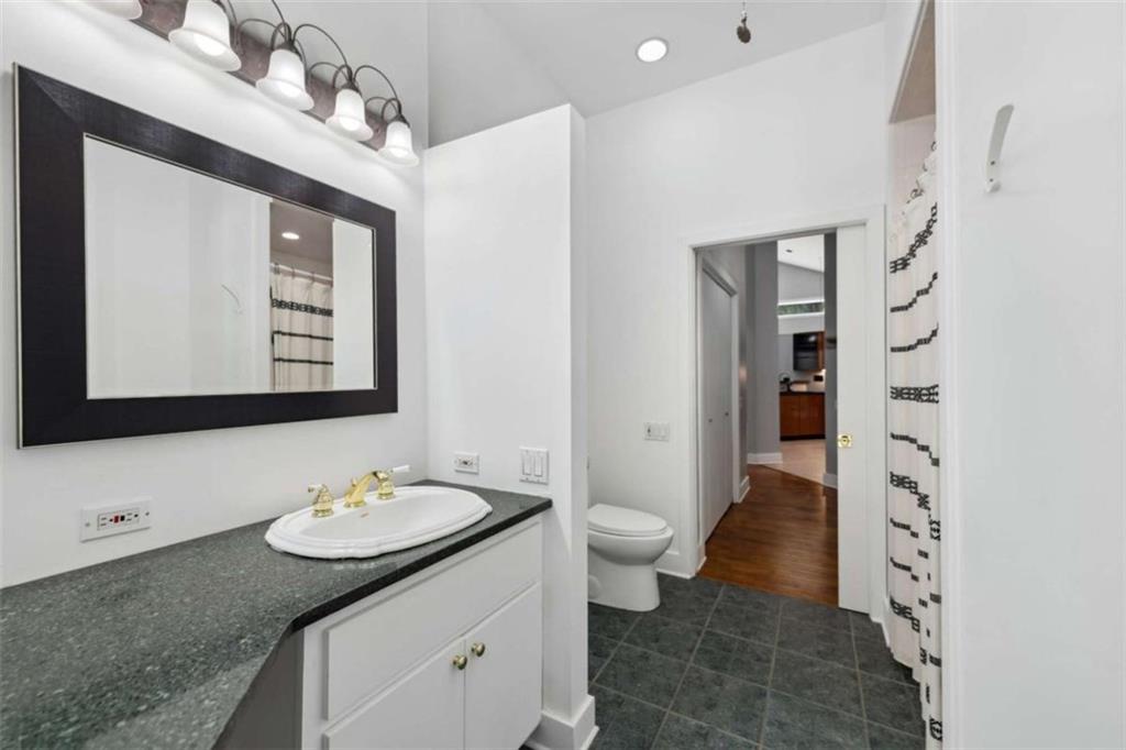 10323 Old CCC Camp Road Chatsworth, GA 30705 - Photo 64 of 97 a bathroom with a sink a toilet and shower