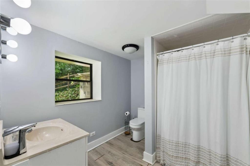 10323 Old CCC Camp Road Chatsworth, GA 30705 - Photo 71 of 97 a bathroom with a toilet a sink and a bath tub