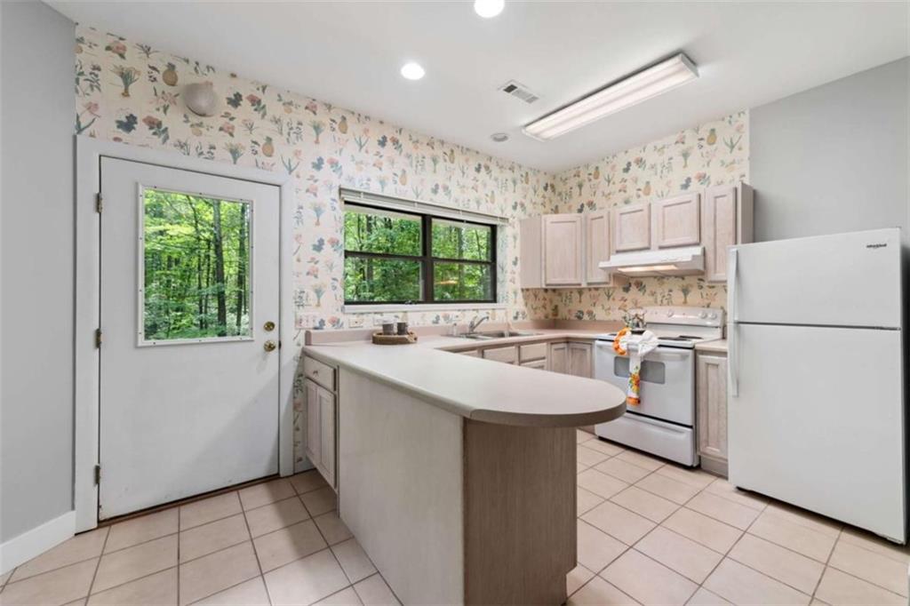 10323 Old CCC Camp Road Chatsworth, GA 30705 - Photo 80 of 97 a kitchen with a sink a refrigerator and window