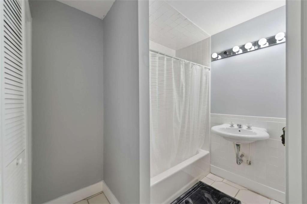 10323 Old CCC Camp Road Chatsworth, GA 30705 - Photo 90 of 97 a bathroom with a sink a toilet and shower