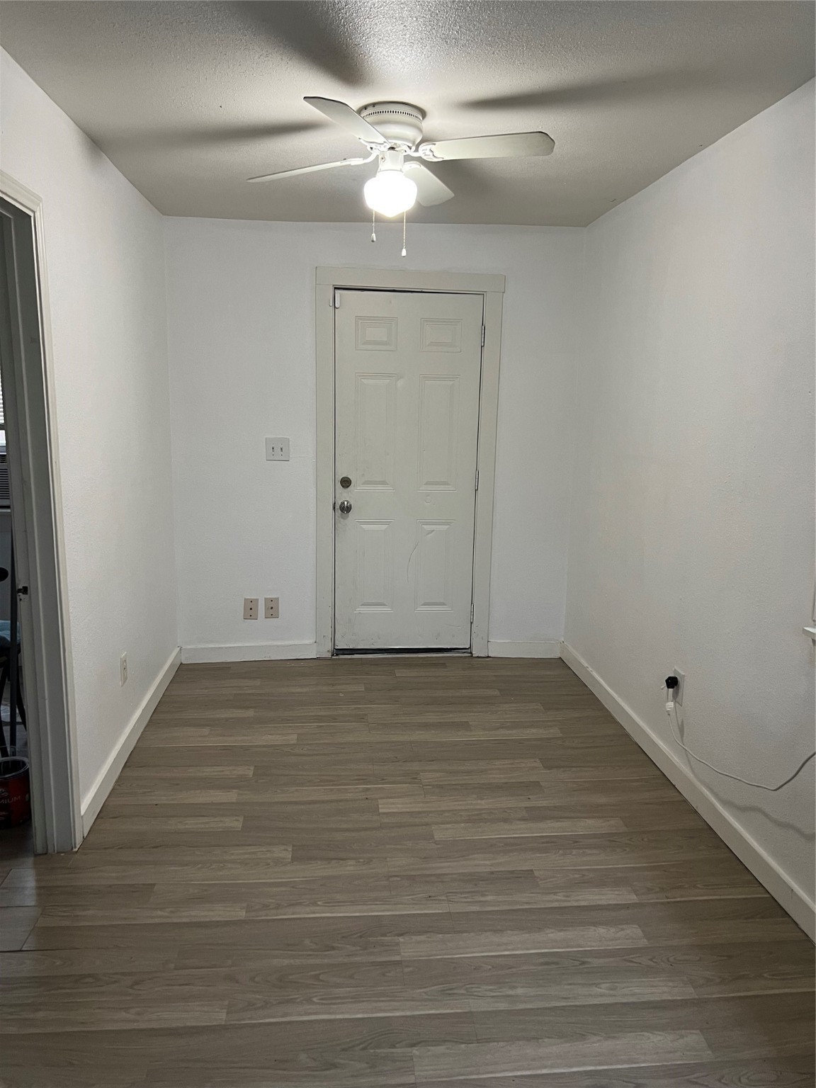 7909 Brutus Street, Unit 3 Houston, TX 77012 - Photo 3 of 9 a view of an empty room with wooden floor
