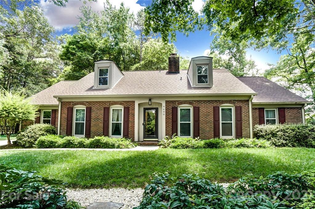 9600 Riddick Place Matthews, NC 28105 - Photo 1 of 38 a front view of a house with garden