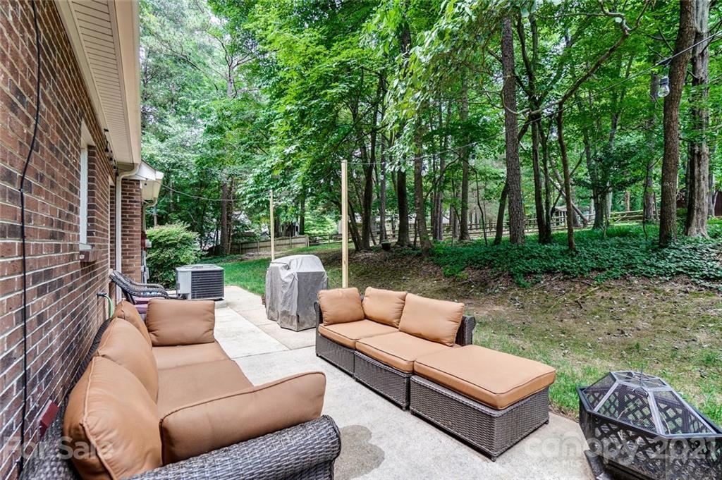 9600 Riddick Place Matthews, NC 28105 - Photo 33 of 38 a view of a patio with couches and a big yard
