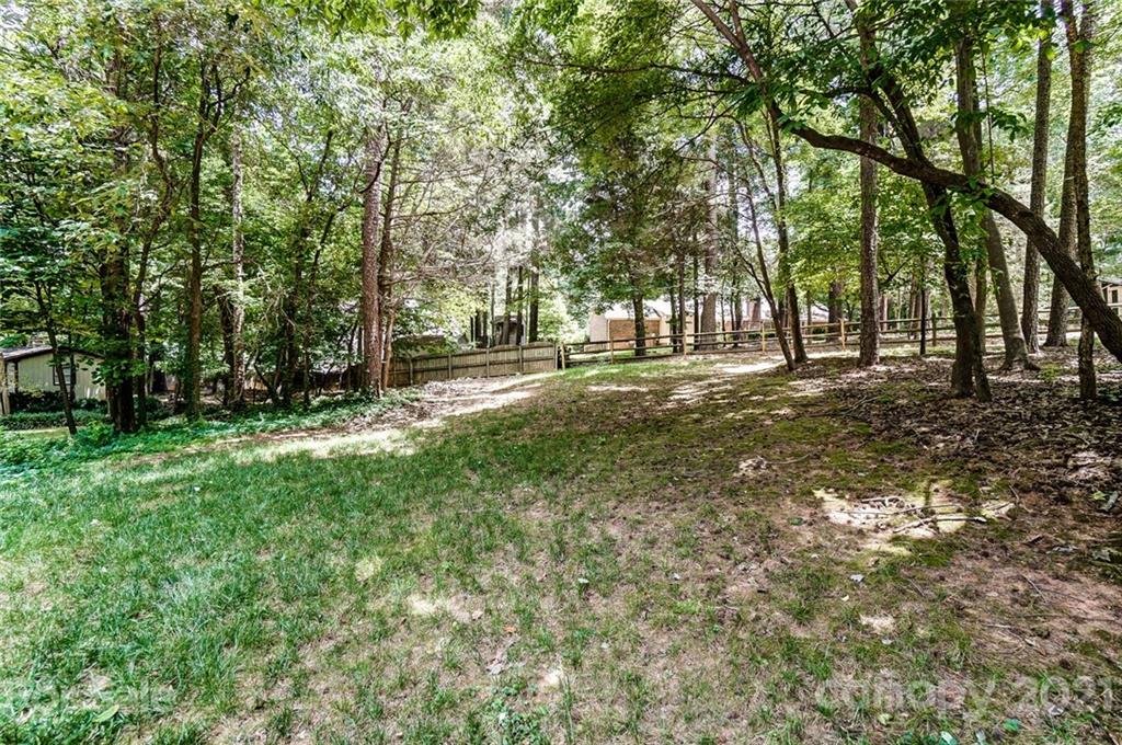 9600 Riddick Place Matthews, NC 28105 - Photo 36 of 38 a view of a yard with a tree