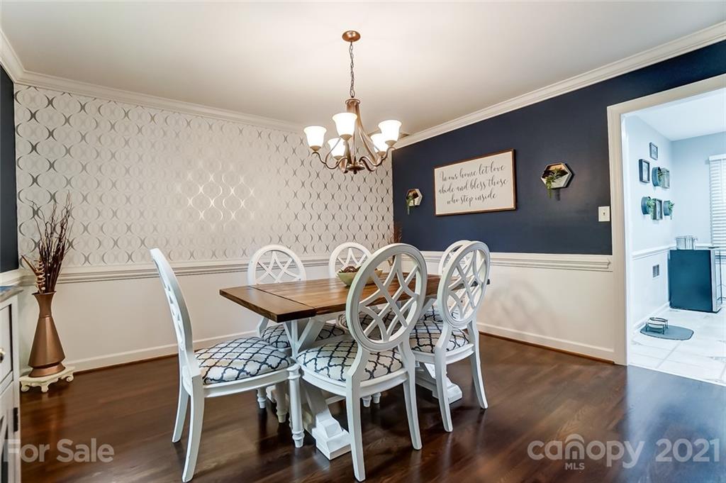 9600 Riddick Place Matthews, NC 28105 - Photo 5 of 38 a view of a dining room with furniture and wooden floor