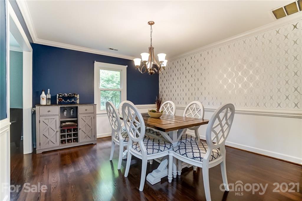 9600 Riddick Place Matthews, NC 28105 - Photo 6 of 38 a view of a dining room with furniture and wooden floor
