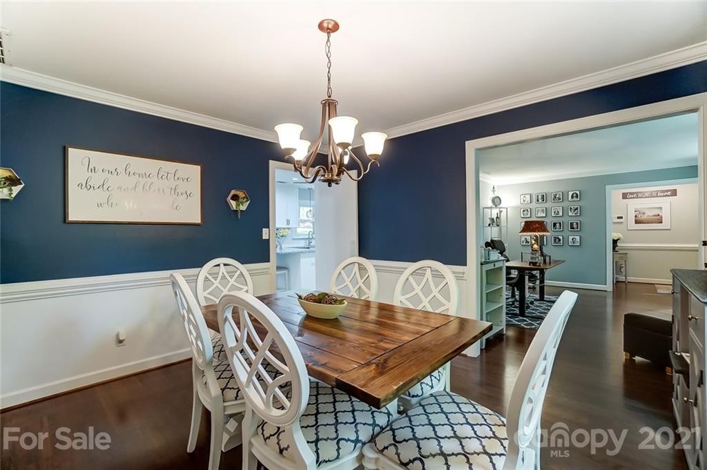 9600 Riddick Place Matthews, NC 28105 - Photo 7 of 38 a view of a dining room with furniture and chandelier