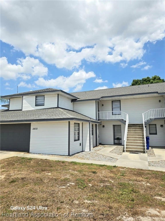 2830 North Lake Damon Road, Unit A Avon Park, FL 33825 - Photo 1 of 20 front view of a house with a big yard