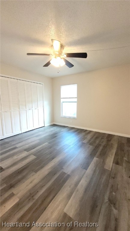 2830 North Lake Damon Road, Unit A Avon Park, FL 33825 - Photo 13 of 20 an empty room with wooden floor fan and windows