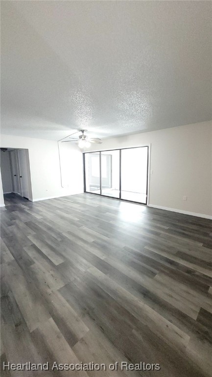 2830 North Lake Damon Road, Unit A Avon Park, FL 33825 - Photo 19 of 20 a view of an empty room with wooden floor and a window