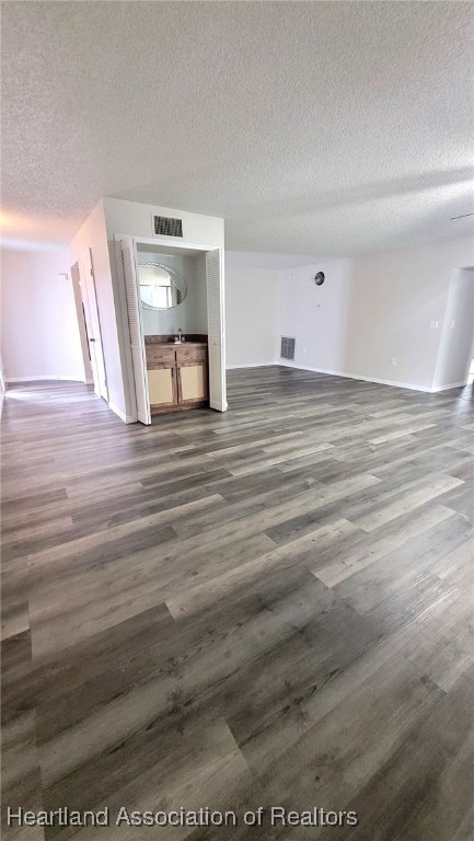 2830 North Lake Damon Road, Unit A Avon Park, FL 33825 - Photo 2 of 20 a view of a room with wooden floor and chair