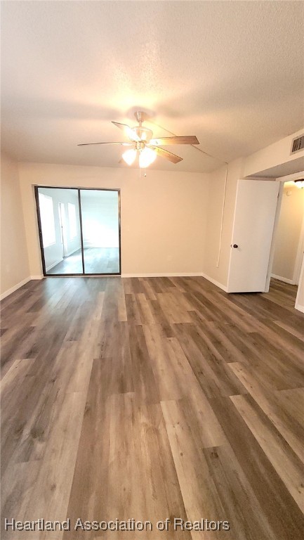 2830 North Lake Damon Road, Unit A Avon Park, FL 33825 - Photo 7 of 20 a view of empty room with wooden floor and fan