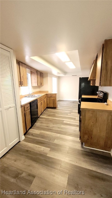 2830 North Lake Damon Road, Unit A Avon Park, FL 33825 - Photo 8 of 20 a view of a kitchen with kitchen island a sink wooden floor and stainless steel appliances