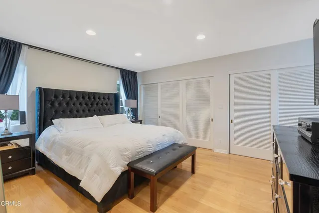 a bedroom with a bed and with furniture