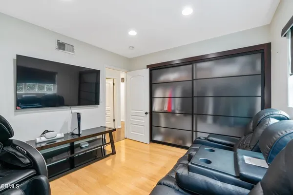 a room with furniture and a flat screen tv