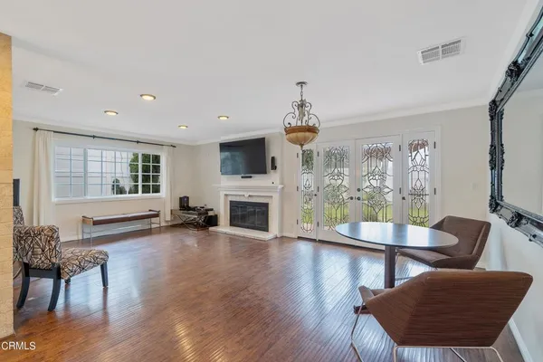 a view of a dining room with furniture window and wooden floor