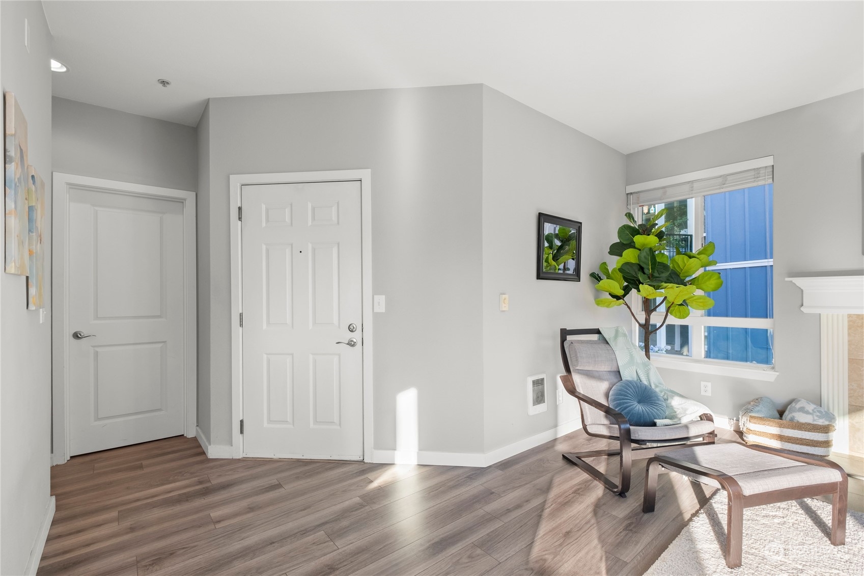 3914 243rd Place Southeast, Unit L203 Bothell, WA 98021 - Photo 13 of 32 a view of a workspace with furniture and a potted plant