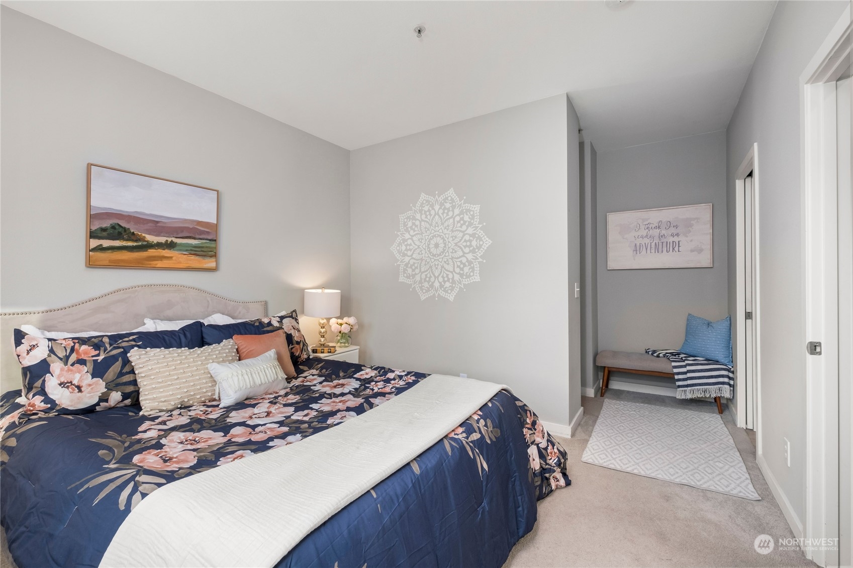 3914 243rd Place Southeast, Unit L203 Bothell, WA 98021 - Photo 16 of 32 a bedroom with a bed and wooden floor