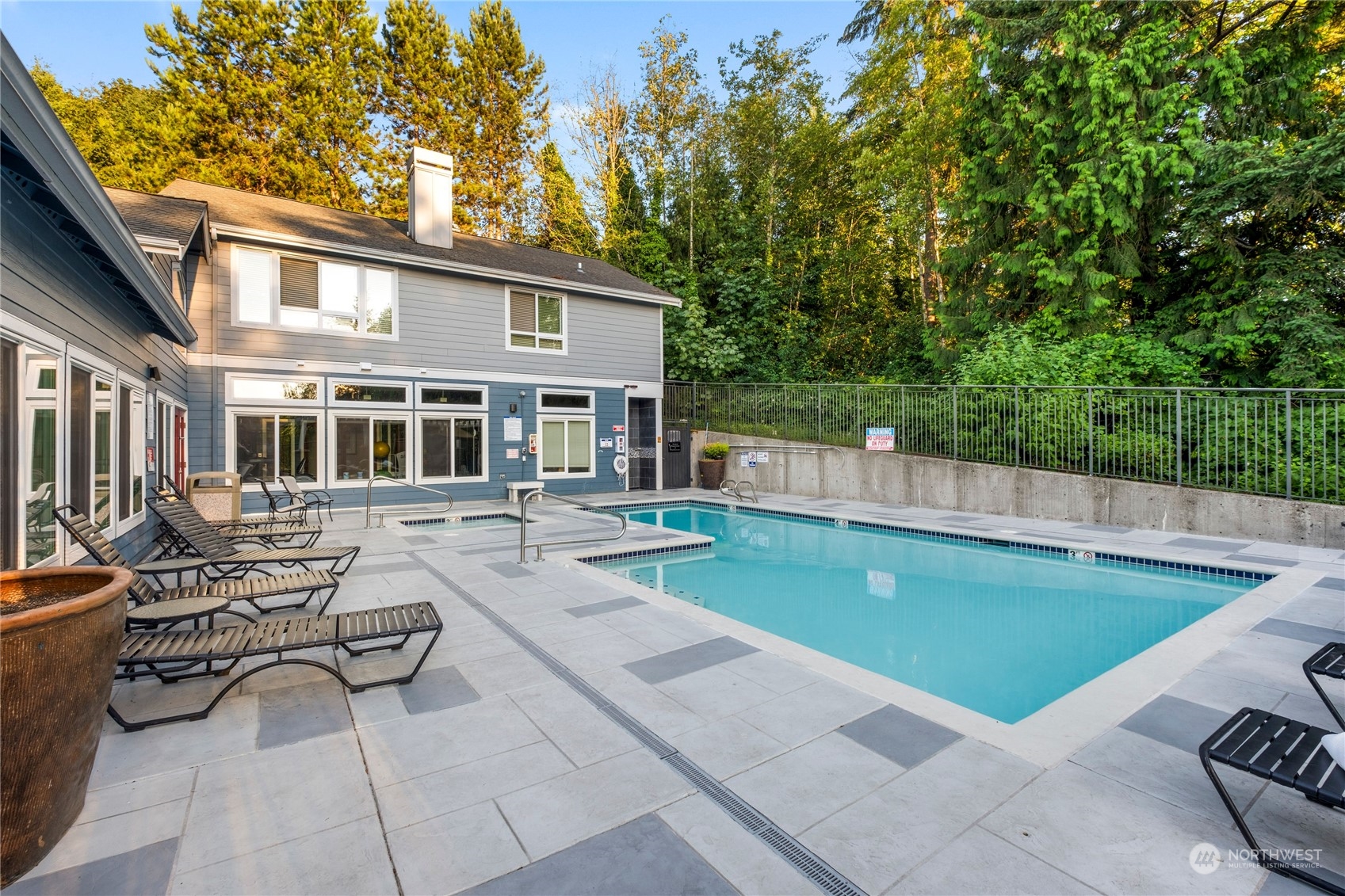 3914 243rd Place Southeast, Unit L203 Bothell, WA 98021 - Photo 27 of 32 a view of a house with swimming pool and sitting area