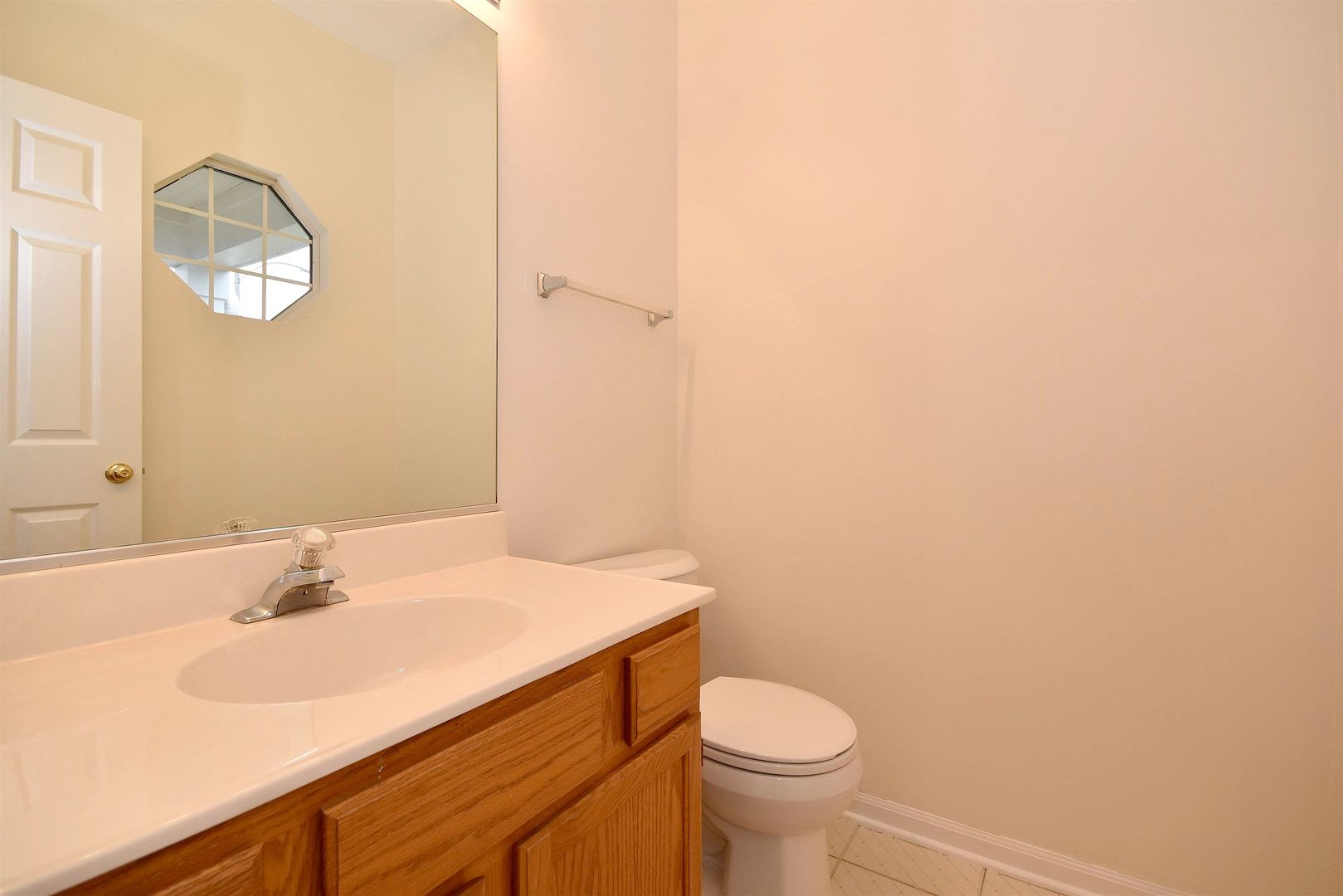 8343 Ripple Ridge Darien, IL 60561 - Photo 17 of 32 a bathroom with a sink and a mirror
