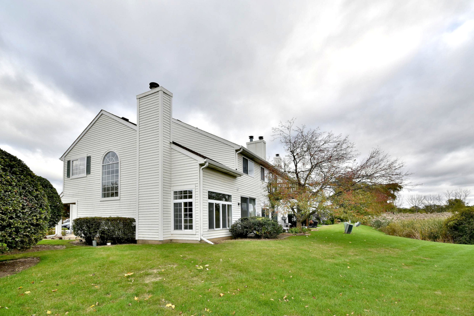8343 Ripple Ridge Darien, IL 60561 - Photo 4 of 32 a front view of a house with a garden