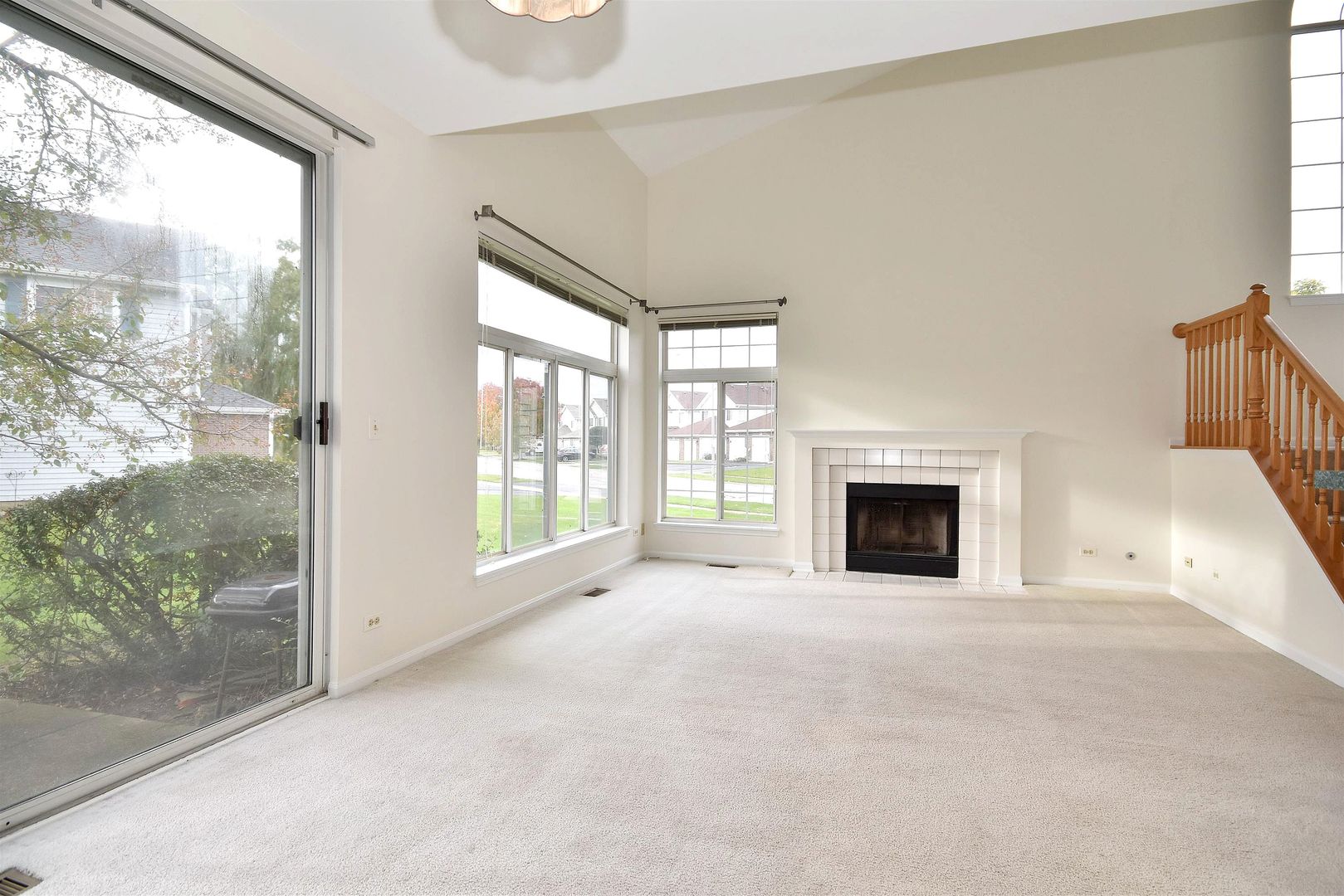8343 Ripple Ridge Darien, IL 60561 - Photo 8 of 32 a view of an empty room with a fireplace and a window