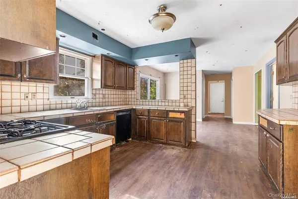 a kitchen with a stove and a sink