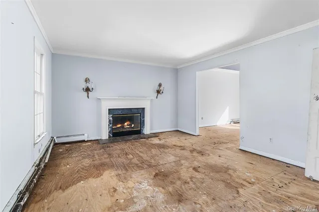 a view of an empty room with a fireplace